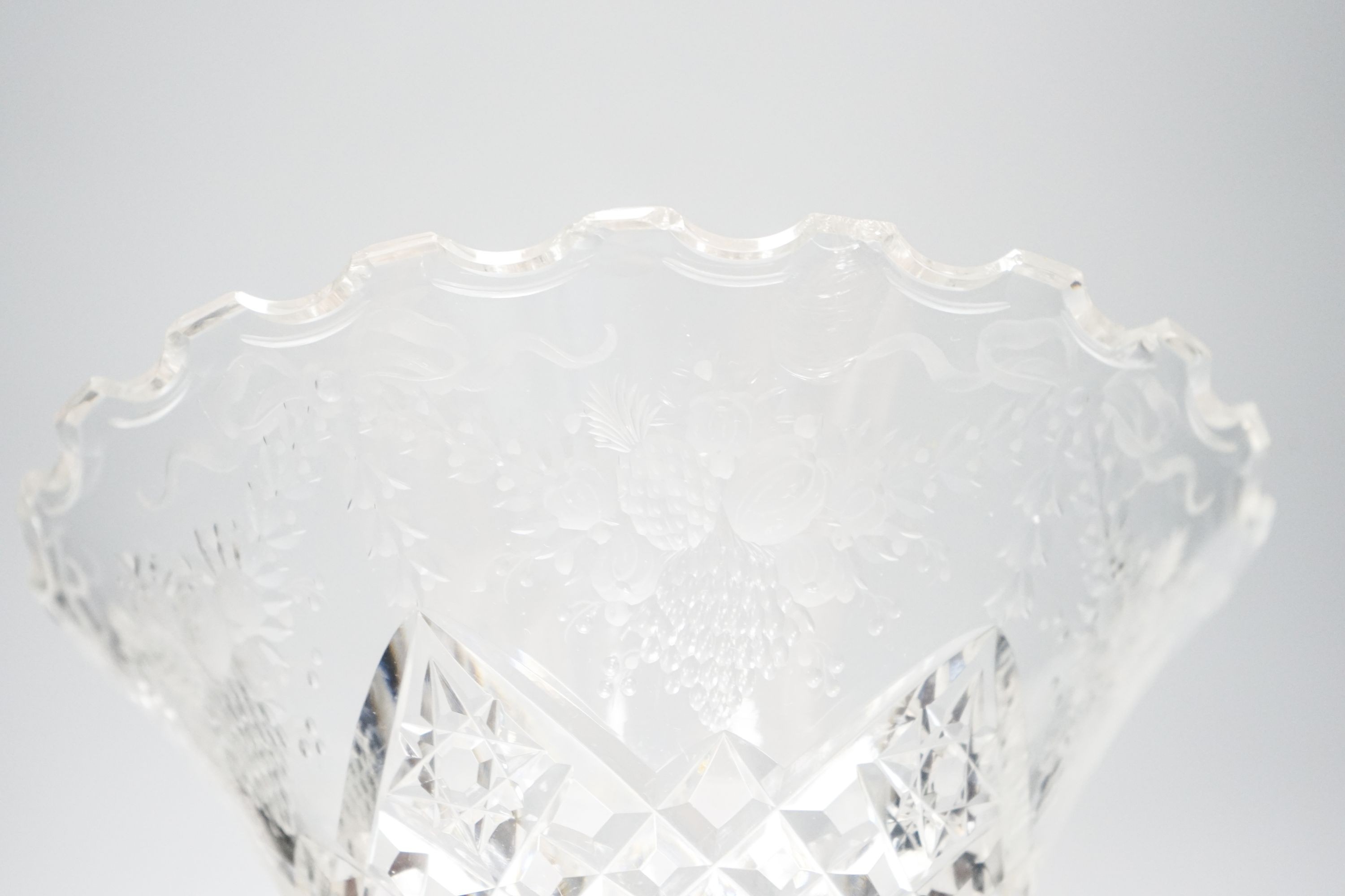 Three early 20th century cut and engraved glass vases 25cm